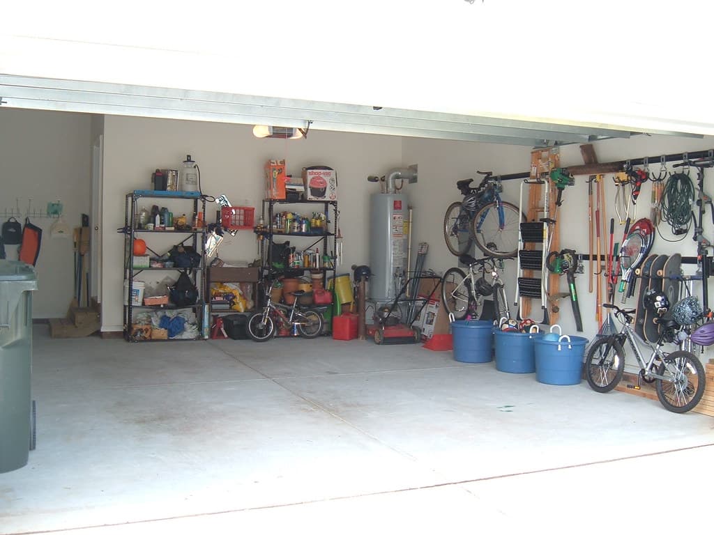 Tidy garage with bikes, tools, and bins organized by zone