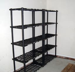 Heavy-duty steel-reinforced storage shelves loaded with bins