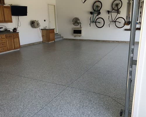 Freshly prepped concrete garage floor ready for coating