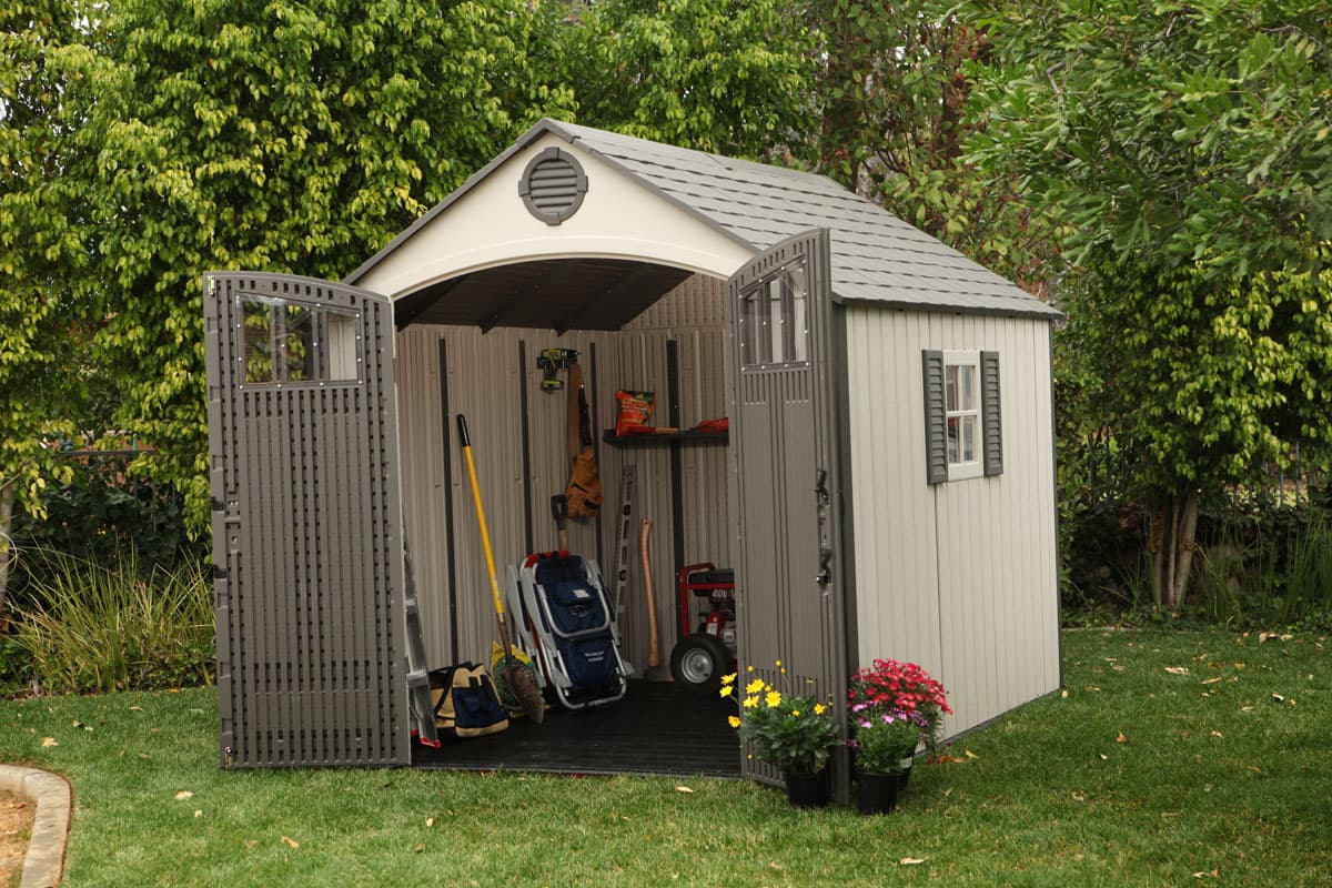 Lifetime resin storage shed assembled in a backyard